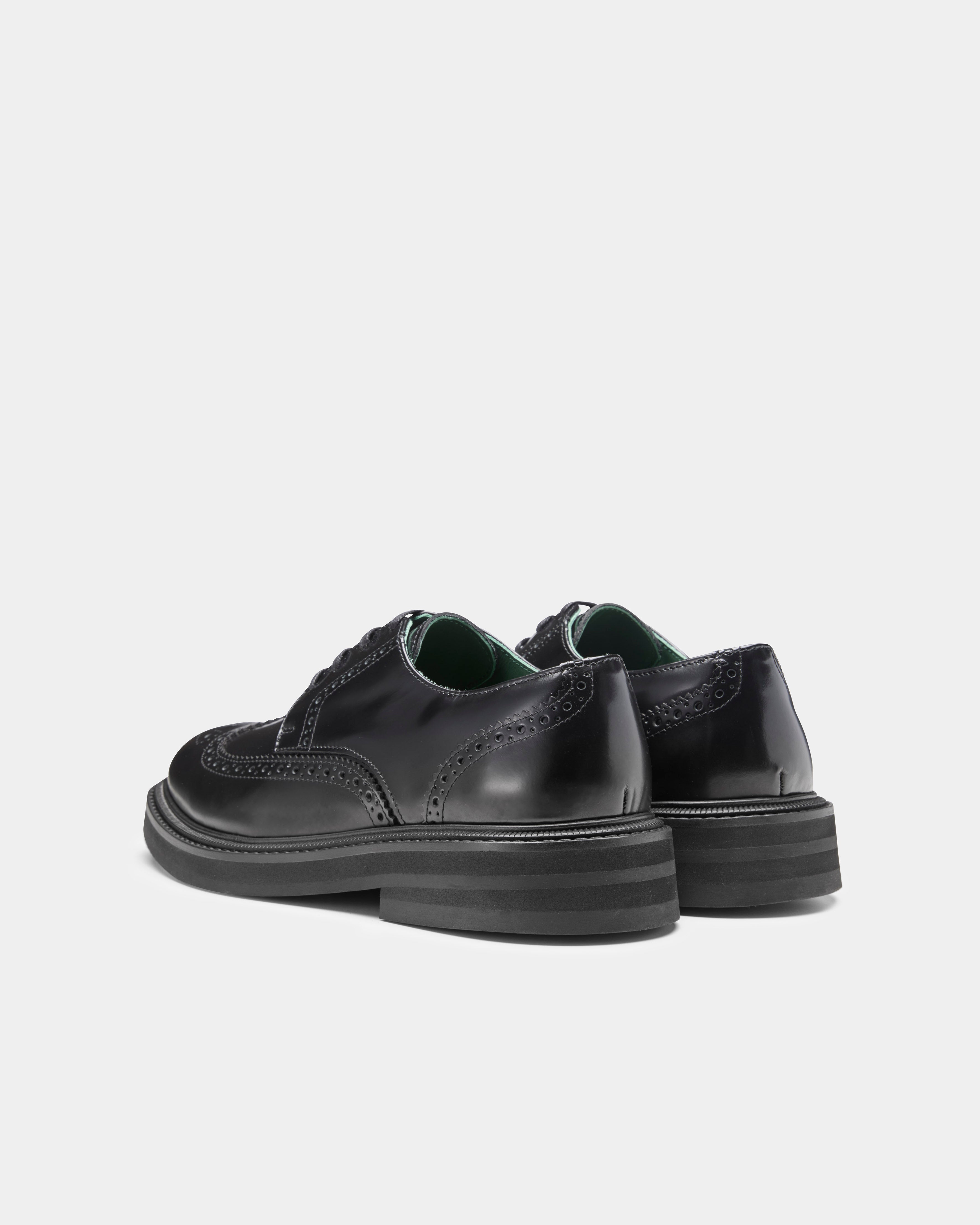 officer brogue in black from the back