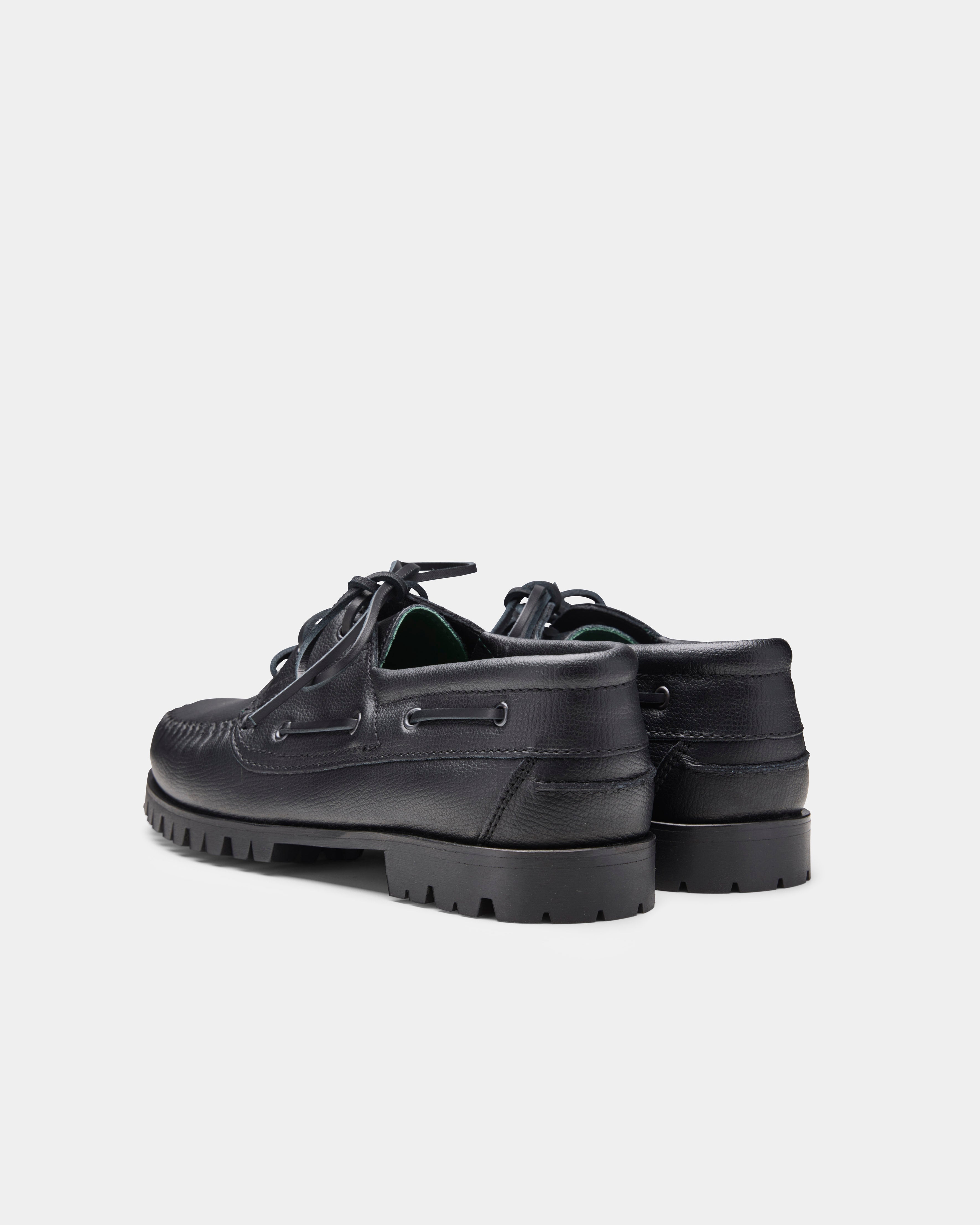 aztec boat shoe in black from the back